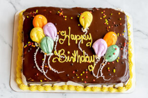 Custom birthday cake with Happy Birthday in frosting as made famous by Sweets by Diane in Roseville, Minnesota