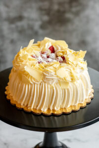 Custom cake topped with chips and strawberries as made famous by Sweets by Diane in Roseville, Minnesota