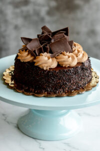 Custom chocolate cake topped with frosting and chocolate chips as made famous by Sweets by Diane in Roseville, Minnesota
