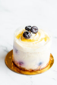 Mini cheesecake topped with frosting and blueberries as made famous by Sweets by Diane in Roseville, Minnesota.jpg
