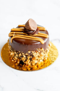 Mini chocolate cake topped with Reeses as made famous by Sweets by Diane in Roseville, Minnesota.