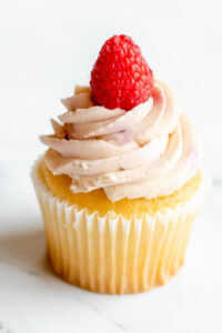 Vanilla cupcake topped with a strawberry and frosting as made famous by Sweets by Diane in Roseville, Minnesota
