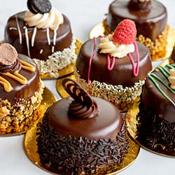 The best chocolate cakes with different fruit, frosting, and cookie toppings in Roseville Minnesota for lunch is served at Sweet & Savory By Diane at the POTLUCK Food Hall in Rosedale Center.
