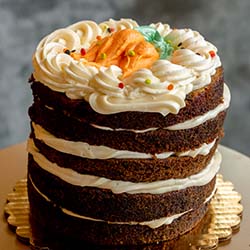 The best multi-layered carrot cake served at Sweet & Savory By Diane in Roseville Minnesota at the POTLUCK Food Hall in Rosedale Center.